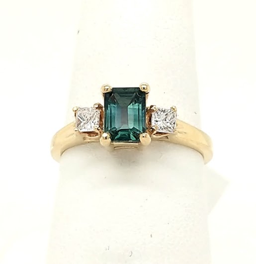 14K Yellow Gold 3 stone ring with .75ct Emerald Cut Sapphire &.25ctw Princess Cut Diamonds finger size 6